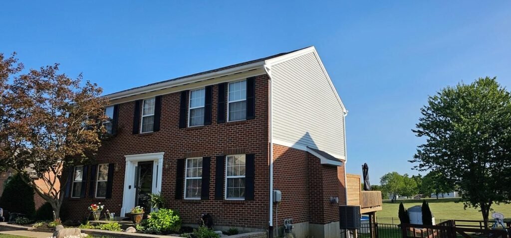 White painted siding on a repainted two story home
