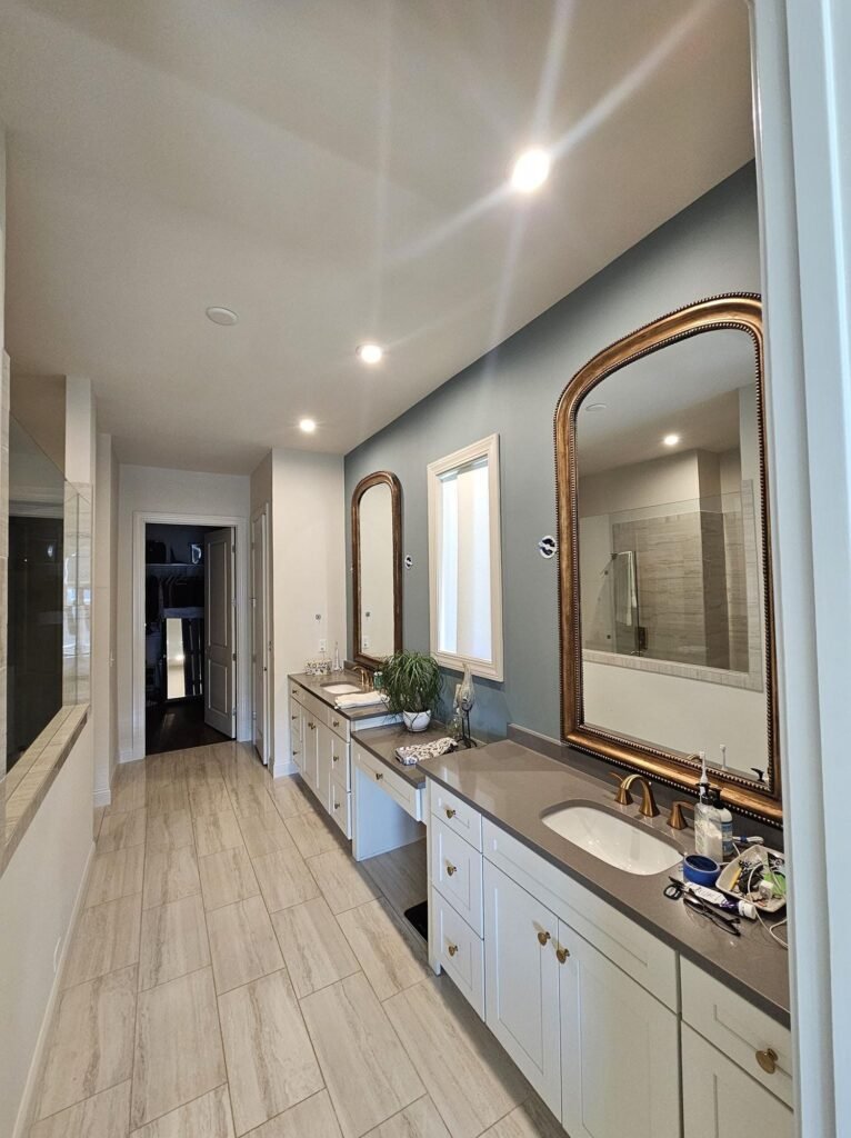 Hallway and bathroom after interior repaint with clean trim work