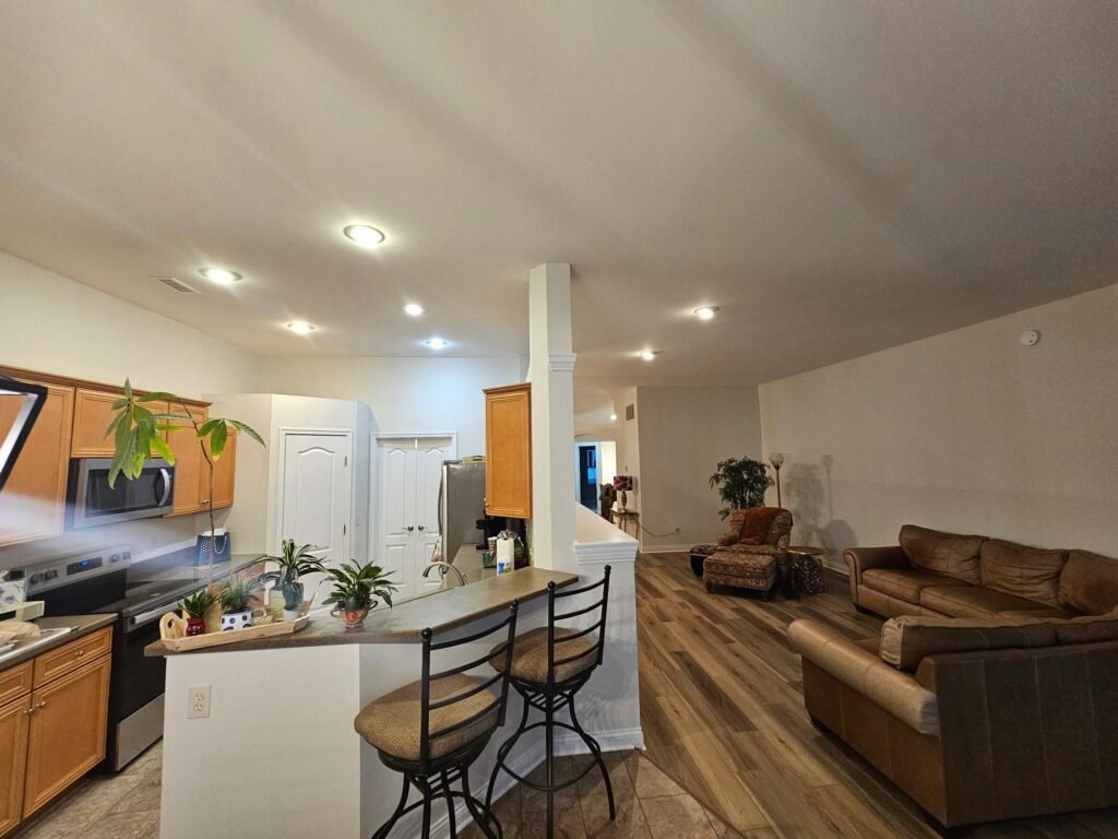 Open concept living area with freshly painted walls and ceilings