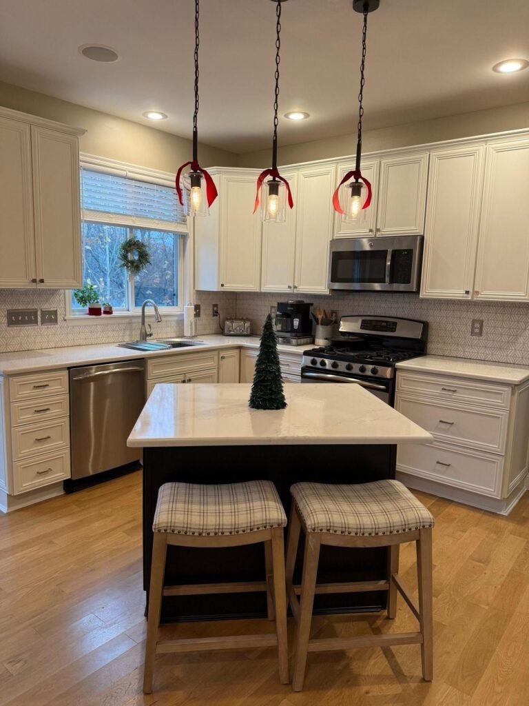 Refinished black kitchen island with pendant lighting