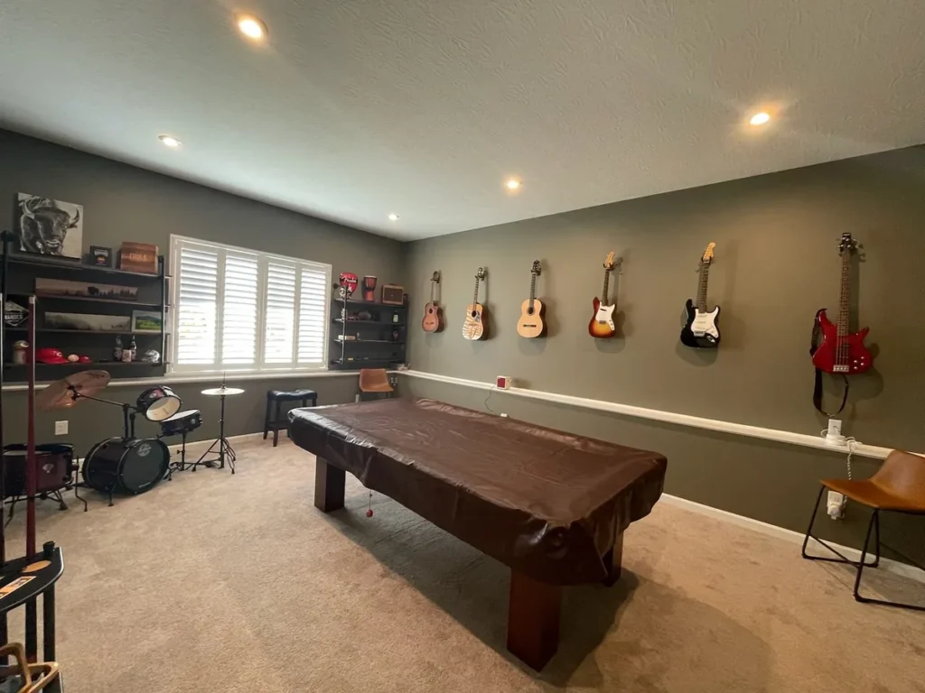 Gray music room walls, white trim and pool table in Alexandria, Kentucky.