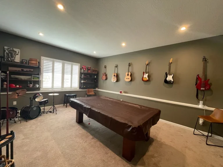 Gray music room walls, white trim and pool table in Alexandria, Kentucky.