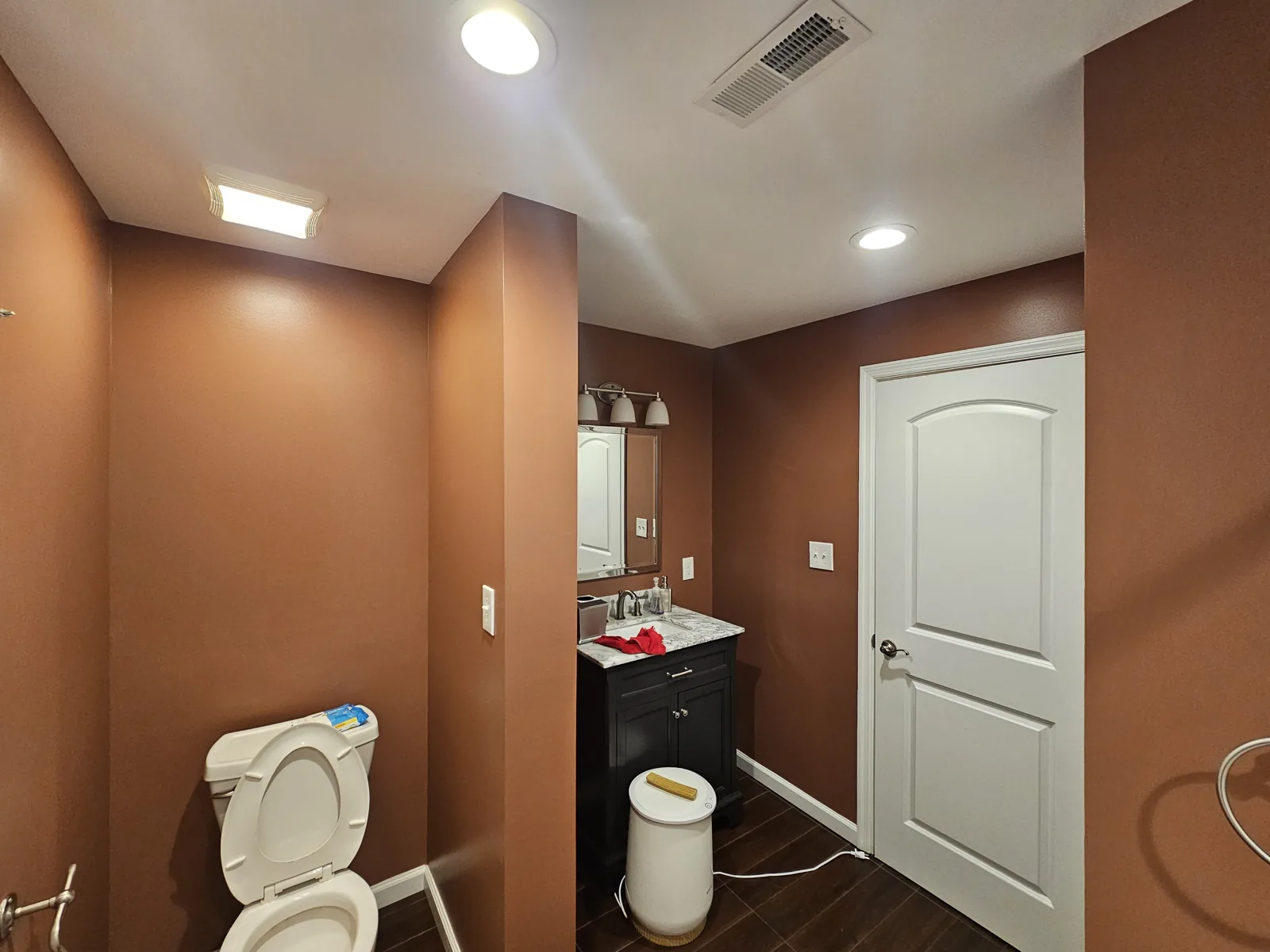 Completed H&H interior project in Augusta, Kentucky, showing warm-colored bathroom walls.