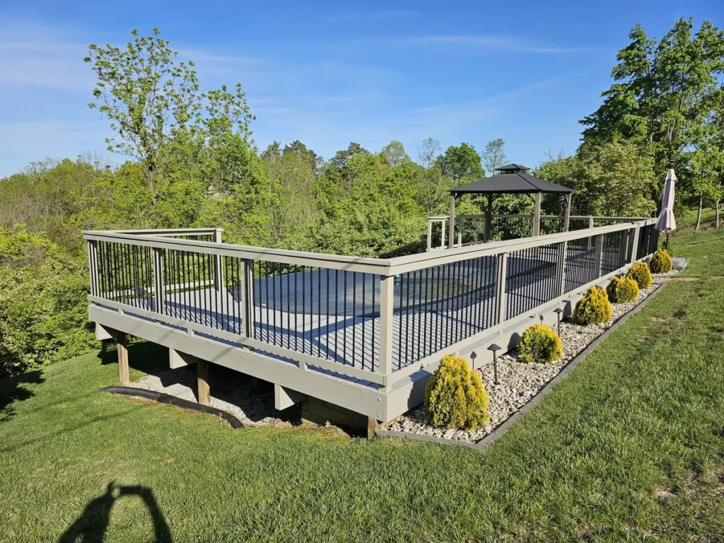 Gray low deck with contrasting dark balusters in Cold Spring, Kentucky.