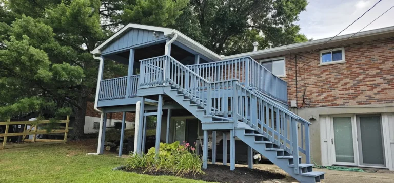 Blue-gray raised deck and stairs from the lawn in Cold Spring, Kentucky.