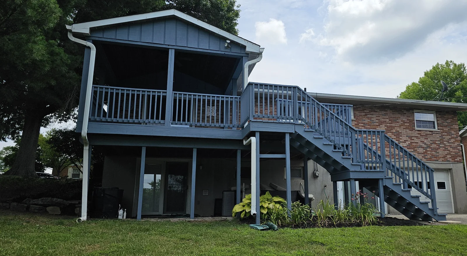 Second view of the blue-gray Cold Spring deck and exterior stair railings.