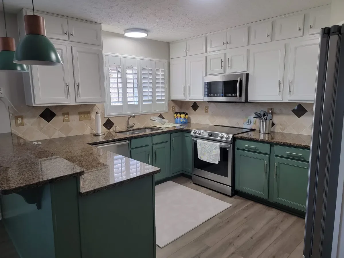 White upper cabinets and green lower cabinet fronts in Independence, Kentucky.