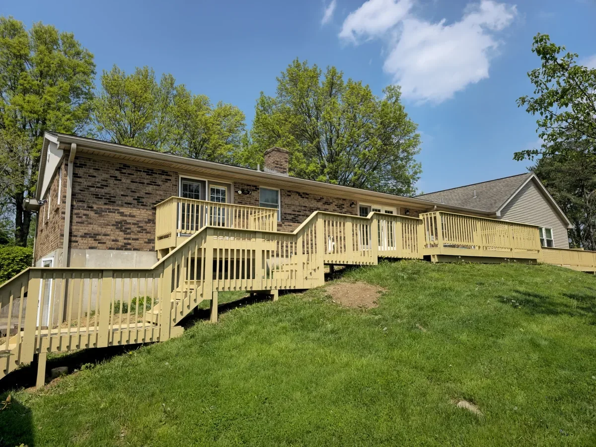 Pale-yellow coated deck, stairs and railings in Independence, Kentucky.